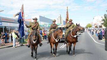 Horsemen turn the corner of the march ahead of the Anzac Day service. 