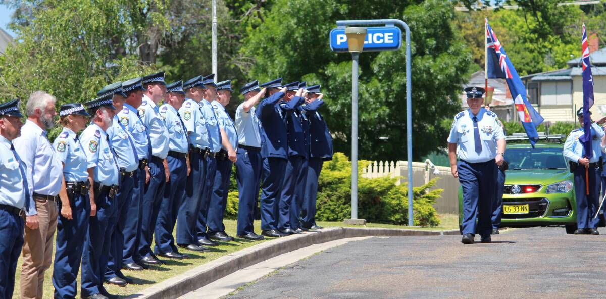 Fond farewell: Officers formed a guard of honour to march Senior Constable Ian Ramma out of Tenterfield Police Station. Photo: NSW Police