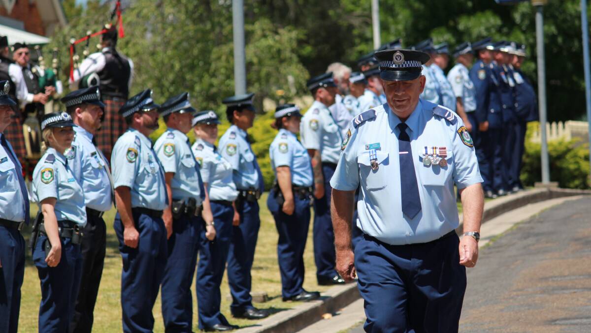 NSW police officers formed a guard of honour to march Senior Constable Ian Ramma out of Tenterfield Police Station. Photos: NSW Police