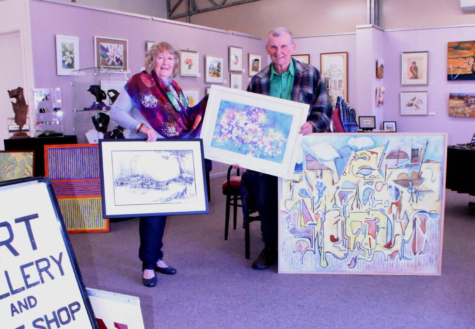 Anni Washington and John Donnelly with a selection of the works included in the exhibition by (from left) Lou Potter, Margaret Oban Dowe and Mr Donnelly himself.