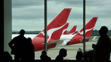 Qantas planes outside a gate lounge. File picture